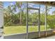 Screened patio overlooking a lush green lawn at 9812 Indian Key Trl # 84, Seminole, FL 33776