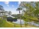 Scenic water view of the community's adjacent canal, featuring lush landscaping and serene waterway at 9812 Indian Key Trl # 84, Seminole, FL 33776