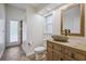Stylish bathroom featuring a stone vessel sink, wood vanity, and tiled shower at 9912 Chris Craft Ct, Tampa, FL 33615