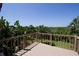 Scenic deck view overlooking lush greenery, offering a private outdoor space at 9912 Chris Craft Ct, Tampa, FL 33615