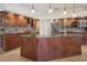 Spacious kitchen with granite countertops, stainless steel appliances, and a large island at 9912 Chris Craft Ct, Tampa, FL 33615