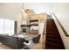Spacious living room with fireplace, vaulted ceilings and open staircase at 9912 Chris Craft Ct, Tampa, FL 33615