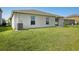 Large backyard featuring lush grass, providing ample space for recreation and outdoor enjoyment at 10326 Boggy Moss Dr, Riverview, FL 33578