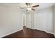 This bright bedroom has wood floors, a closet, and ceiling fan for added comfort at 10326 Boggy Moss Dr, Riverview, FL 33578
