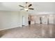 Open-concept living space with tile flooring and views of the kitchen and dining areas at 10326 Boggy Moss Dr, Riverview, FL 33578