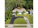 An aerial view of a well-manicured property showcasing a circular driveway and lush landscaping at 10406 N Boulevard, Tampa, FL 33612