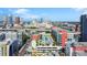 Aerial view pointing to property with rooftop pool and surrounding city, emphasizing the location and amenities at 1120 E Kennedy Blvd # 1127, Tampa, FL 33602