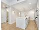 A modern kitchen featuring a white island, stainless steel appliances, and light wood floors at 1120 E Kennedy Blvd # 1127, Tampa, FL 33602