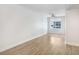An empty living room with wood floors, a window, and a ceiling fan at 1120 E Kennedy Blvd # 1127, Tampa, FL 33602