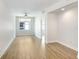 An empty living room with wood floors, a window, and a ceiling fan at 1120 E Kennedy Blvd # 1127, Tampa, FL 33602