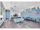 Bright community lounge with a modern kitchen, stylish seating, and large windows offering plenty of natural light at 1120 E Kennedy Blvd # 1127, Tampa, FL 33602