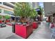 Charming outdoor cafe with ample seating, lush greenery, and a lively atmosphere for dining at 1120 E Kennedy Blvd # 1127, Tampa, FL 33602