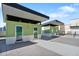 Image features pool area with green cabanas against a blue sky, creating a tranquil outdoor living space at 1120 E Kennedy Blvd # 1127, Tampa, FL 33602