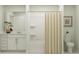 Clean bathroom features a shower-tub combo, vanity with storage, and modern fixtures at 11746 Brae Way, Dade City, FL 33525
