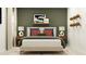 This main bedroom has an area rug, lamps on the nightstands, throw pillows, and decorative orbs on the wall at 11746 Brae Way, Dade City, FL 33525