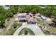 Sprawling single-story home featuring a screened-in pool and a three-car garage on a large lot at 13110 Manistee Rd, Weeki Wachee, FL 34614