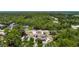 Aerial view showcasing a home nestled among lush trees, offering privacy and a serene setting at 13110 Manistee Rd, Weeki Wachee, FL 34614