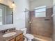 Bathroom featuring granite counters and a tiled shower at 13110 Manistee Rd, Weeki Wachee, FL 34614