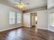 Large bedroom with wood look floors, neutral paint, and many windows at 13110 Manistee Rd, Weeki Wachee, FL 34614