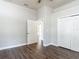 Bedroom featuring hardwood floors, a ceiling fan, and a closet at 13110 Manistee Rd, Weeki Wachee, FL 34614