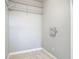 Walk in closet with wire shelves and tiled floor at 13110 Manistee Rd, Weeki Wachee, FL 34614