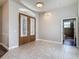 Foyer boasts tile flooring and a decorative front door, adjacent to a full bathroom at 13110 Manistee Rd, Weeki Wachee, FL 34614