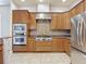 A bright kitchen features stainless steel appliances, gas range, and tile backsplash at 13110 Manistee Rd, Weeki Wachee, FL 34614