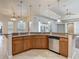 Kitchen with stone countertops, stainless steel dishwasher and breakfast bar at 13110 Manistee Rd, Weeki Wachee, FL 34614