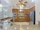 Spacious kitchen featuring stainless appliances, rich wood cabinetry, and granite countertops at 13110 Manistee Rd, Weeki Wachee, FL 34614