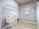 Laundry room offering a utility sink and tiled floors at 13110 Manistee Rd, Weeki Wachee, FL 34614