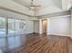 Living room with hardwood flooring and sliding glass doors to the screened-in patio at 13110 Manistee Rd, Weeki Wachee, FL 34614