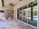 Patio features outdoor kitchen, complete with built-in grill, sink, and cabinetry, and screened pool at 13110 Manistee Rd, Weeki Wachee, FL 34614