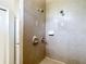 Modern shower with dual showerheads and sleek neutral tile, complemented by brushed nickel fixtures at 13110 Manistee Rd, Weeki Wachee, FL 34614