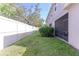 A fenced backyard provides privacy alongside a screened in porch to enjoy outdoor living at 14245 Damselfly Dr, Tampa, FL 33625