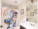 Cute bathroom features shower with whimsical dinosaur and unicorn-themed curtain at 14245 Damselfly Dr, Tampa, FL 33625