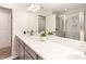 Bathroom featuring double sinks, modern fixtures, and glass enclosed shower at 14245 Damselfly Dr, Tampa, FL 33625