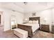 Bright bedroom featuring a large bed, matching nightstands, and ample closet space at 14245 Damselfly Dr, Tampa, FL 33625
