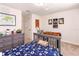 Soccer themed bedroom features a soccer themed bedspread, lots of light and fun decor at 14245 Damselfly Dr, Tampa, FL 33625