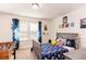 This cozy bedroom features a soccer theme, carpeted floors, and lots of natural light at 14245 Damselfly Dr, Tampa, FL 33625