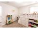 This cute bedroom features a lofted bed, playful toy kitchen and carpeted floors at 14245 Damselfly Dr, Tampa, FL 33625