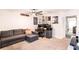 Comfortable game room with gray couch, desk, and modern ceiling fan at 14245 Damselfly Dr, Tampa, FL 33625