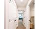 Bright hallway featuring linen closet, and views of the additional rooms at 14245 Damselfly Dr, Tampa, FL 33625
