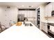 Modern kitchen with stainless steel appliances, pantry, and ample counter space at 14245 Damselfly Dr, Tampa, FL 33625