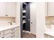 Spacious kitchen featuring custom cabinets, shelving, and designer finishes at 14245 Damselfly Dr, Tampa, FL 33625