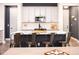 Kitchen island with seating and modern appliances create a chef's dream space at 14245 Damselfly Dr, Tampa, FL 33625