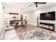 Open concept living room and kitchen features sleek floors and modern finishes at 14245 Damselfly Dr, Tampa, FL 33625