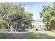 A well-maintained community playground featuring a slide and play equipment near picnic area at 14245 Damselfly Dr, Tampa, FL 33625