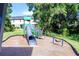 Community playground features a slide and multiple play structures for fun-filled outdoor activities at 14245 Damselfly Dr, Tampa, FL 33625