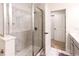 Modern bathroom featuring glass enclosed shower and sleek fixtures at 14245 Damselfly Dr, Tampa, FL 33625