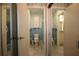 View of two bathrooms, one with a toilet and the other with a double vanity at 1444 Eastfield Dr, Clearwater, FL 33764